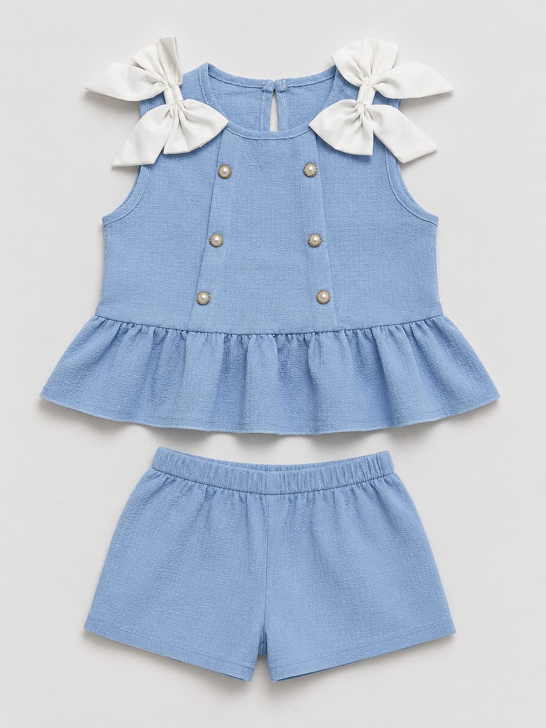 CONJUNTO BLUSA CELESTE CON MOÑOS Y BOTONES — conjunto para niña
