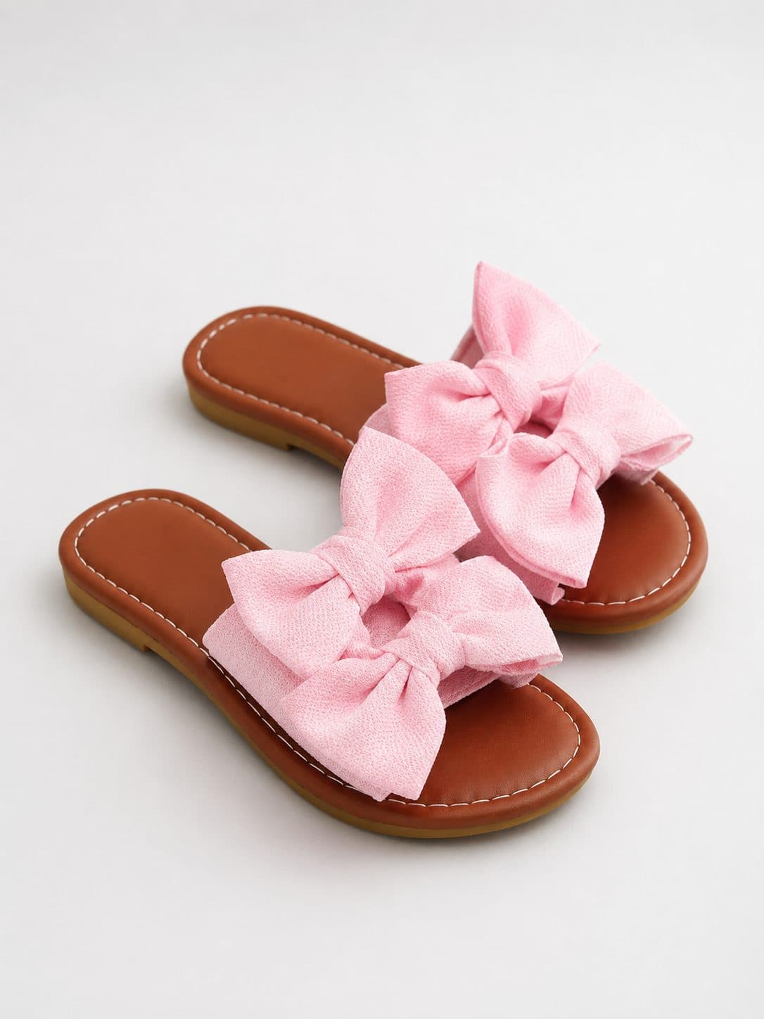 SANDALIAS TIPO SLIDE CON DOBLE MOÑO ROSADO — zapatos para niña