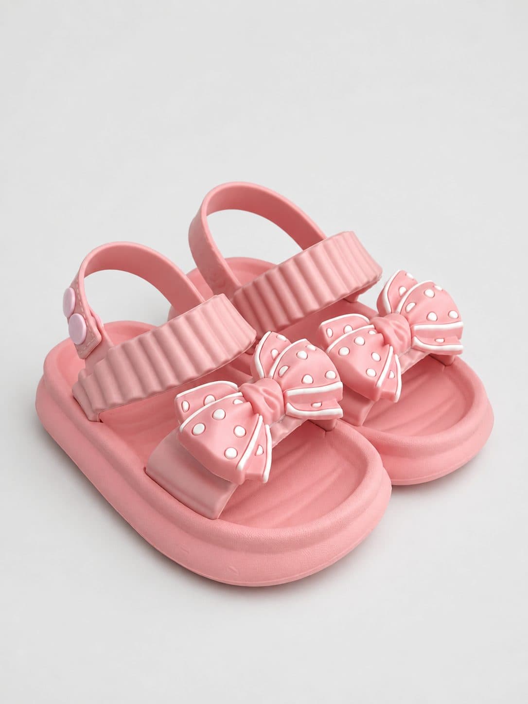 SANDALIAS TIPO SLIDE ROSADAS CON MOÑO — zapatos para niña