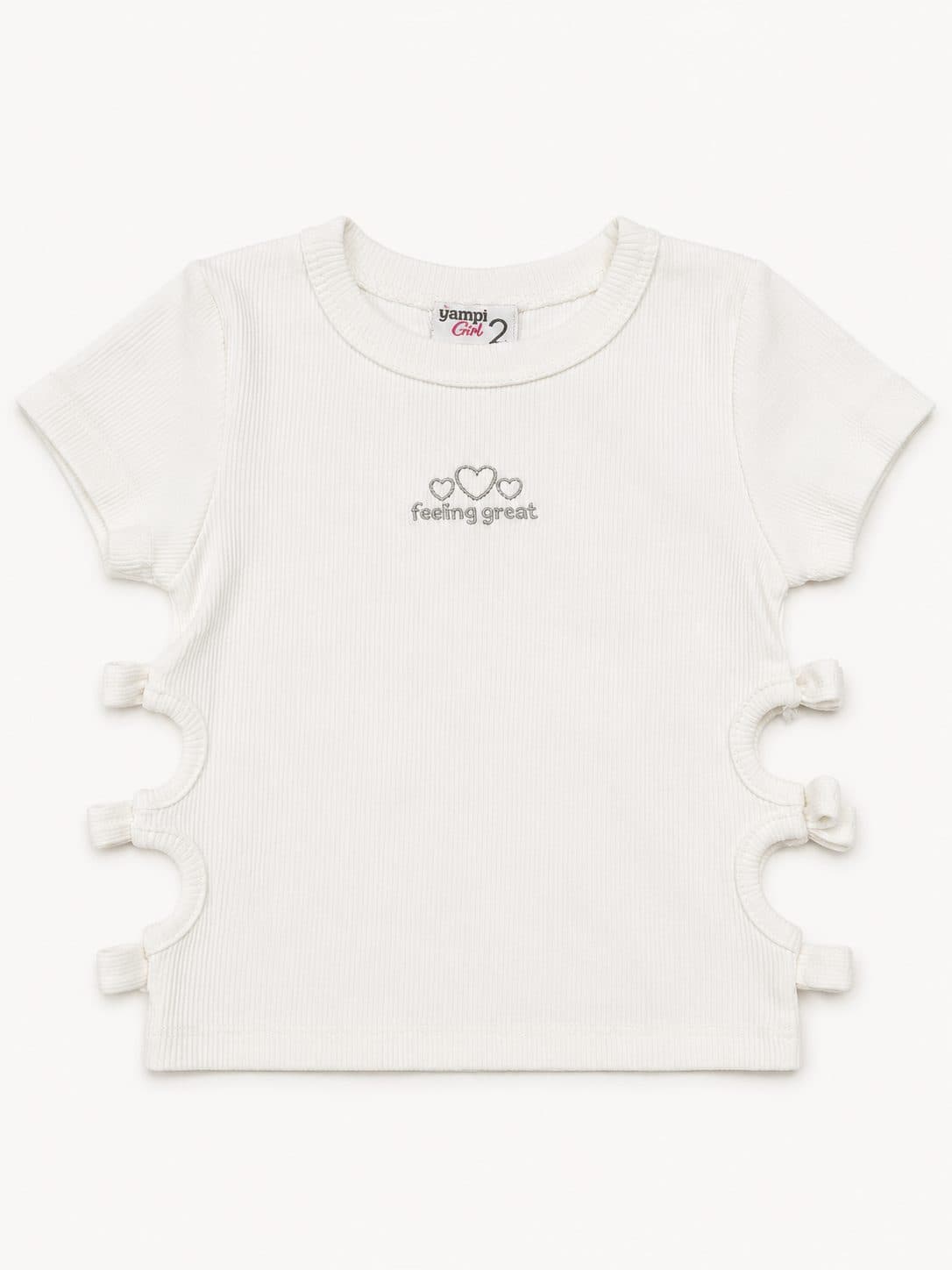 POLO BLANCO CANALÉ CON RECORTES Y LAZOS — polo para niña