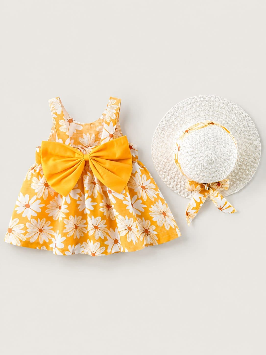 VESTIDO AMARILLO CON ESTAMPADO DE MARGARITAS Y MOÑO — vestido para niña