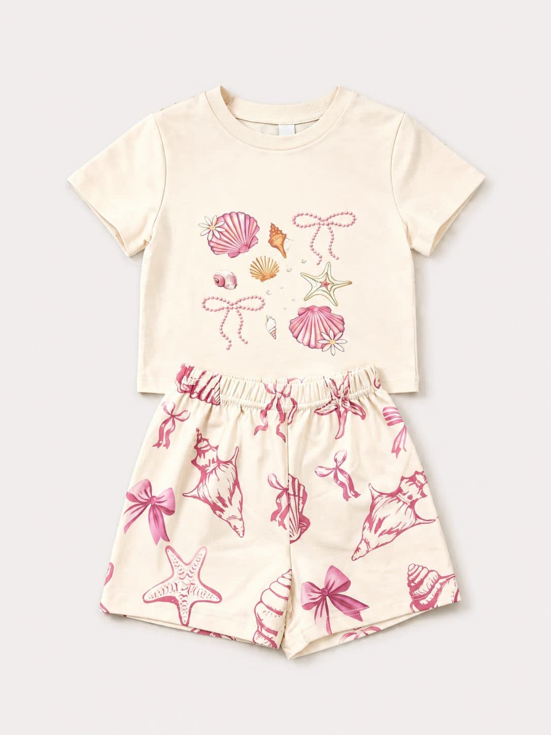 CONJUNTO CREMA CON ESTAMPADO MARINO Y MOÑOS ROSA — conjunto para niña