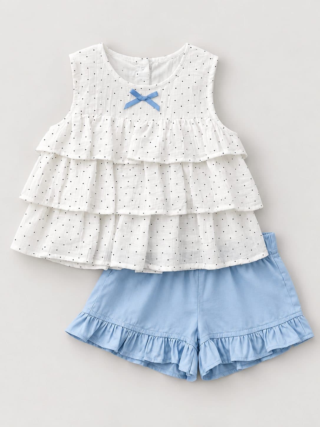 CONJUNTO BLANCO Y CELESTE CON BLUSA EN CAPAS — conjunto para niña